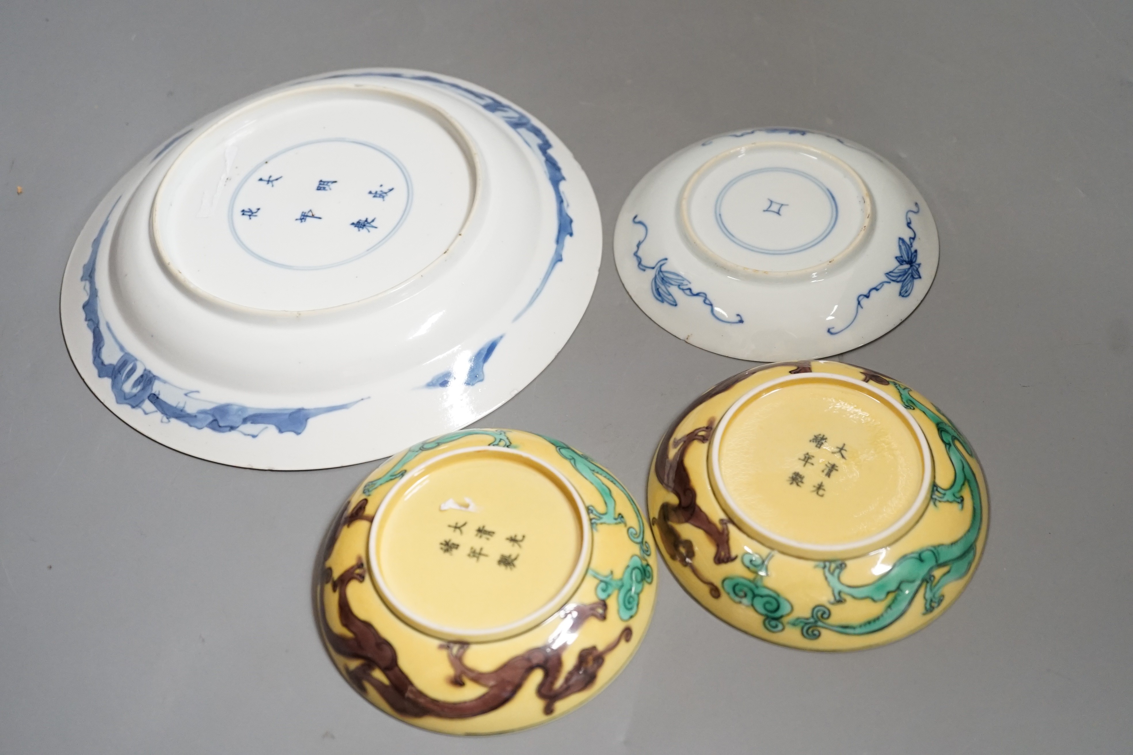 A pair of Chinese dragon dishes, a Kangxi blue and white plate, a Kangxi blue and white dish with chenghua mark